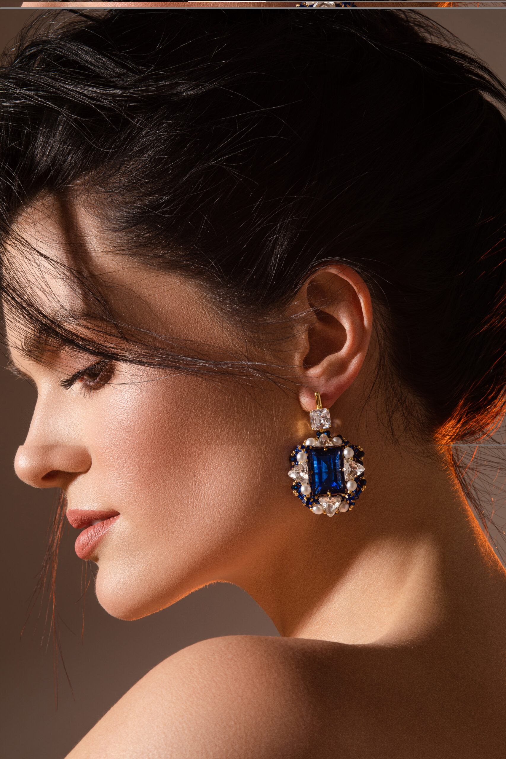 elegant young woman with beautifully styled hair in studio